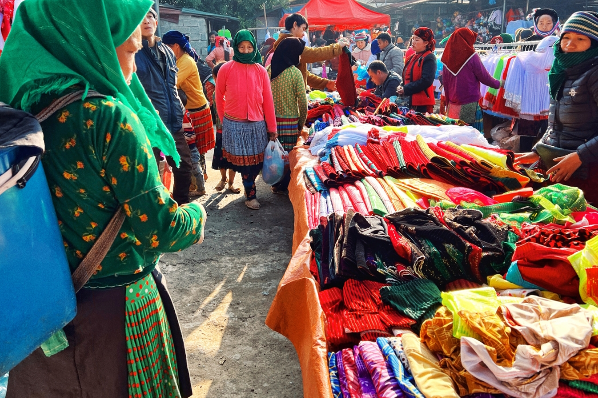 Local women in traditional ethnic attire at Yen Minh Market